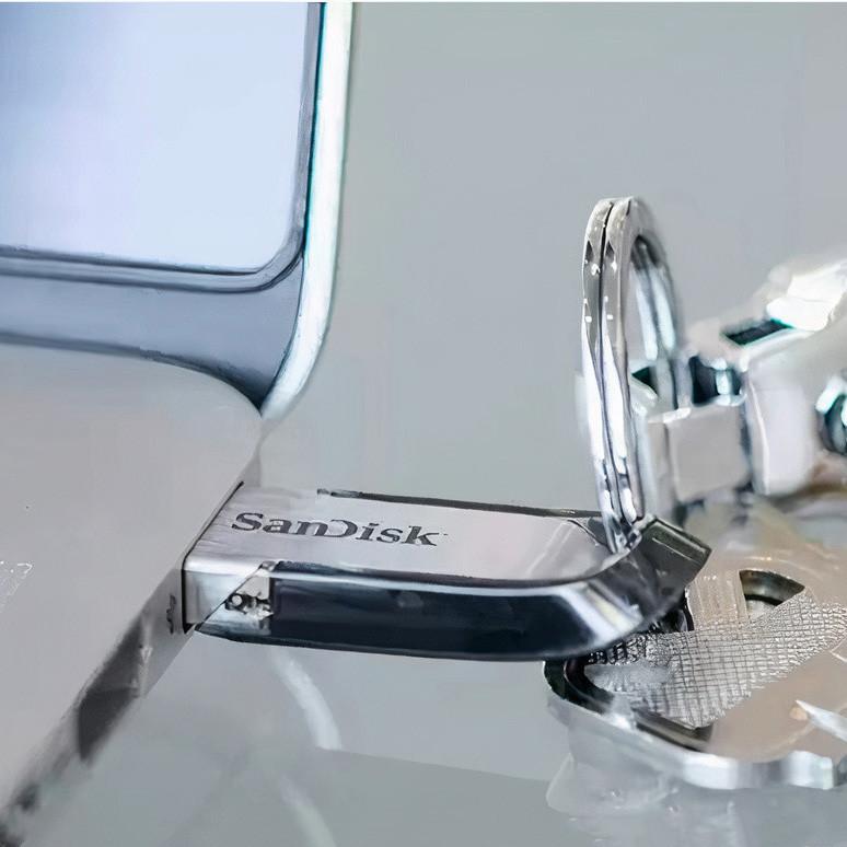 فلش مموری سن دیسک مدل Ultra Flair CZ73 ظرفیت 16 گیگابایت با بدنه فلزی، پورت USB 3.0، سازگار با USB 2.0 و قابلیت رمزگذاری فایل‌ها